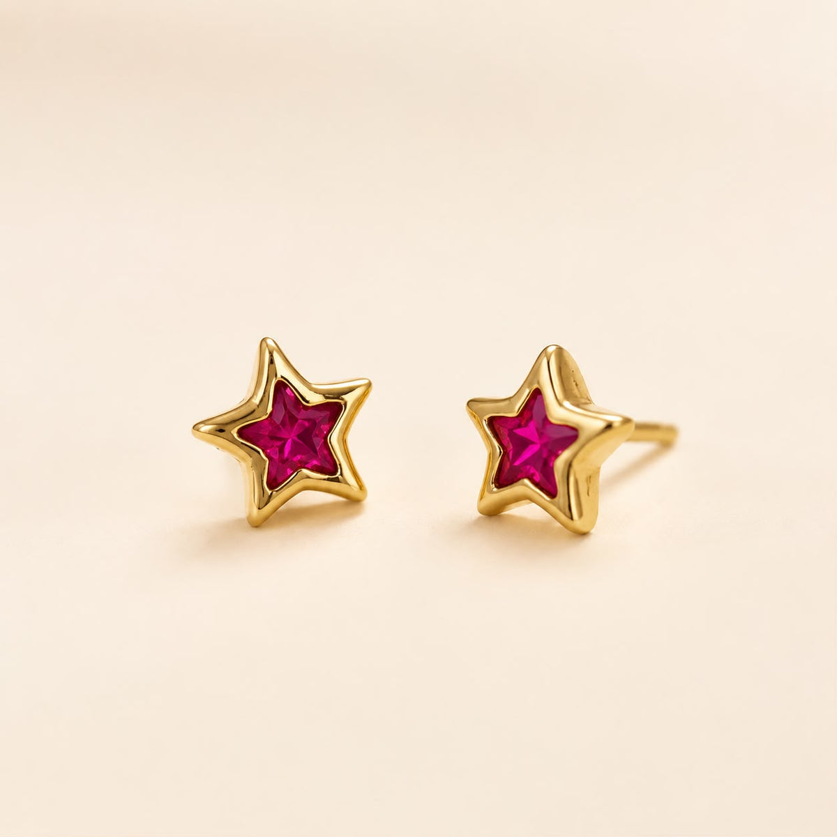 Aretes estrella fuscia