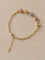Pulsera con balines tonos