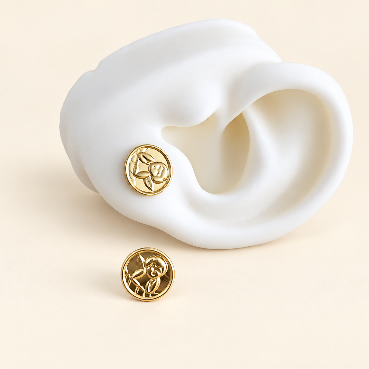 Aretes de moneda con angel