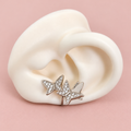 Earcuff plateado de mariposas  con brillo