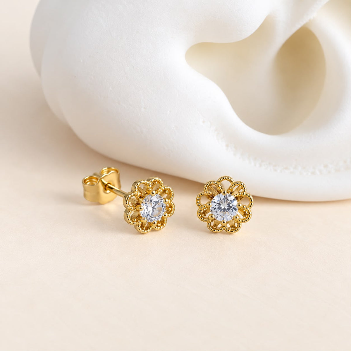 Aretes míni de flor con piedra