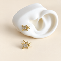 Aretes doble estrella con brillo y dorado