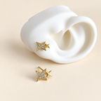 Aretes doble estrella con brillo y dorado